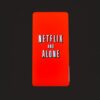 Minimalist design featuring Netflix and Alone text on a red background.