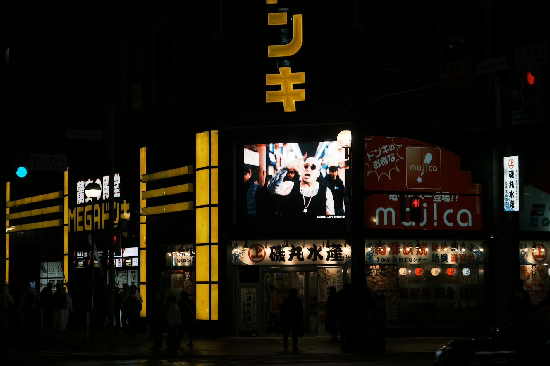 Neon-lit street scene at night in Sapporo, Japan, showcasing the vibrant city nightlife.