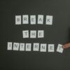 Textual phrase 'Break the Internet' arranged on a black background with a pointing hand.