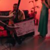 Behind the scenes of a movie set in a stylish indoor setting with clapperboard ready for action.