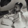 A touching black and white photograph of a father gently touching his daughter's face.