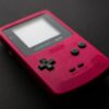Red Nintendo Game Boy close-up showcasing retro gaming console design.