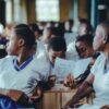 African students in a classroom collaborate on a learning assignment.