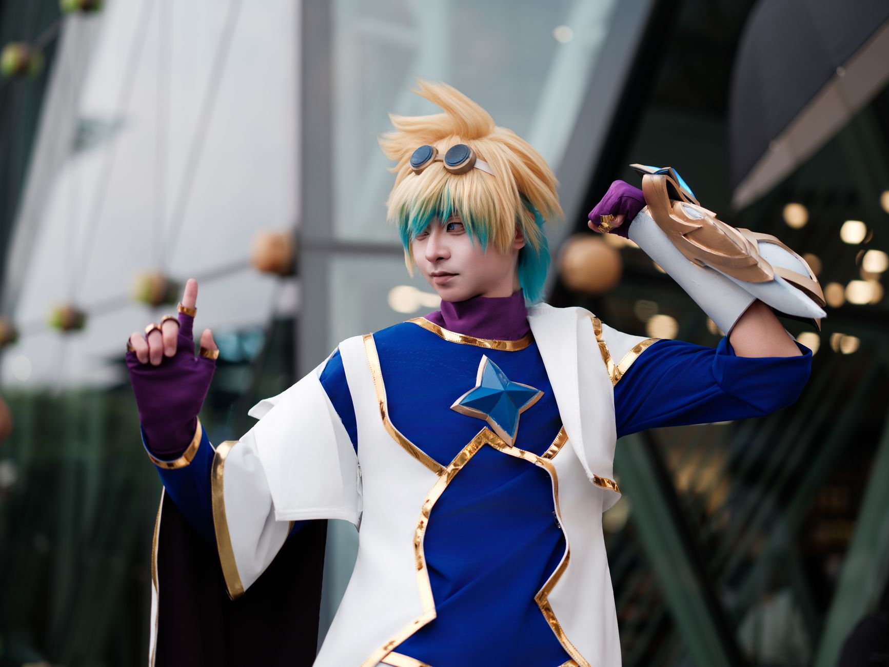 Dynamic cosplay portrait of a sci-fi character with colorful costume and playful pose outdoors.