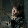 Portrait of a young man with gas mask in a decayed, urban setting.