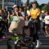 Group of diverse marathon runners in athletic gear participating in an outdoor race with positive energy.