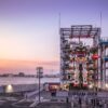 A stunning sunset view of the Gundam robot at Yokohama's waterfront, Japan.