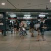 A crowded Bishan MRT station with commuters moving through the transit area.