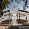 Beautiful open-air beachfront wedding venue with a stylish canopy setup.