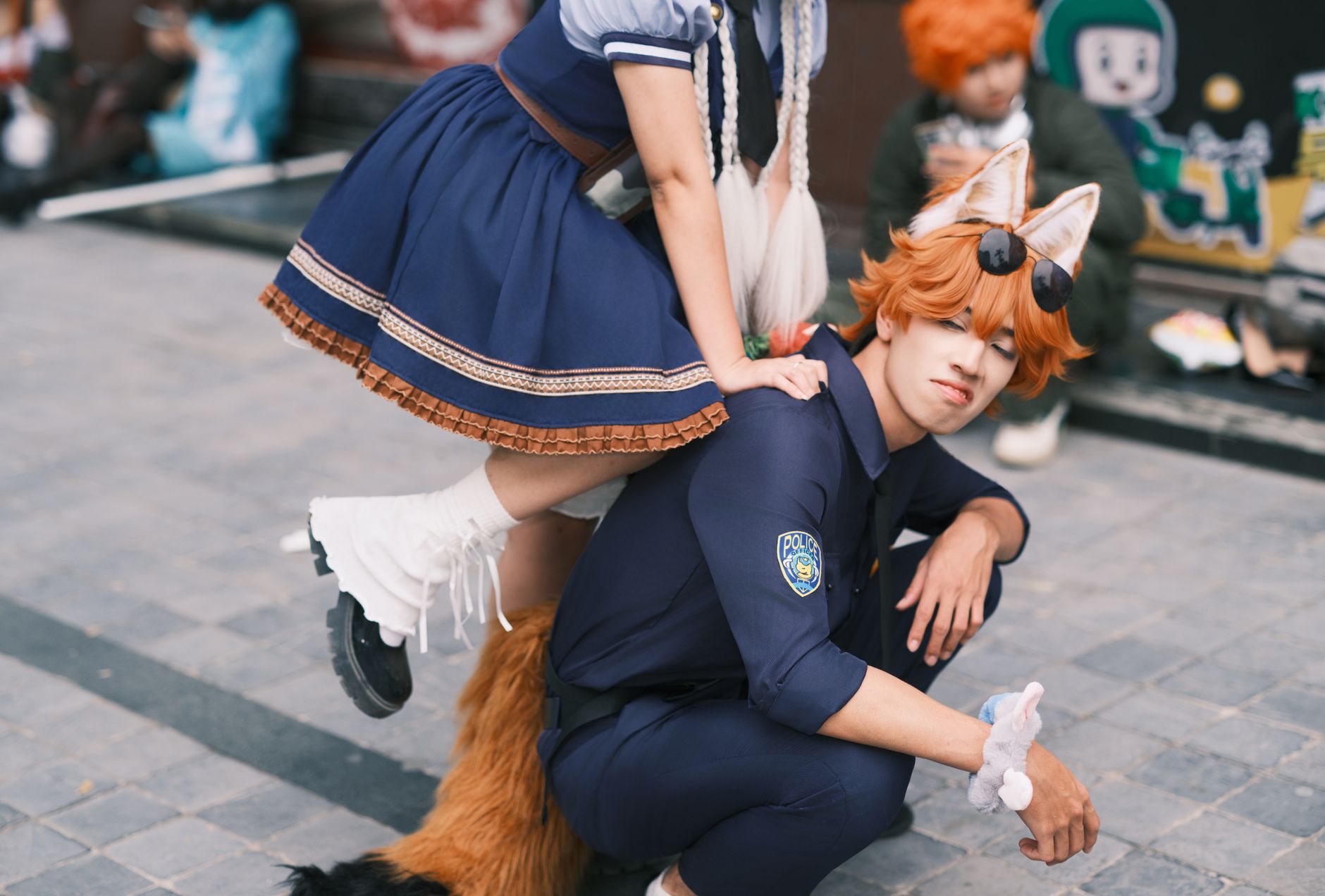 Cosplayers dressed uniquely pose joyfully outdoors. Explore creativity and cosplay culture.