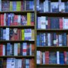 Vibrant array of books on shelves inside a bookstore, showcasing literature diversity.